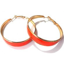 Сережки-кільця з помаранчевою емаллю. Позолота. Діаметр: 5.5 см. Ширина: 11 мм.