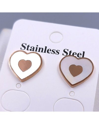 Сережки-гвоздики Stainless Steel з білою емаллю. Сталь. Позолота ЧВ. Довжина: 14 мм. Ширина: 14 мм.