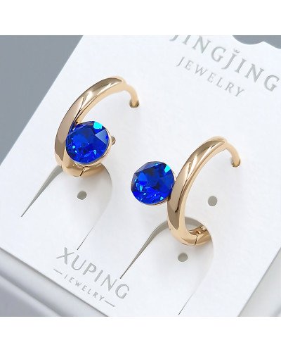 Сережки XР. Позолота 18К. Камені: Swarovski синього кольору. Діаметр: 15 мм. Ширина: 8 мм.