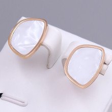 Сережки-гвоздики Stainless Steel з білою емаллю. Сталь. Позолота ЧВ. Довжина: 17 мм. Ширина: 12 мм.