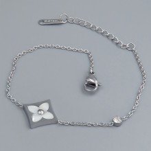 Браслет Stainless Steel з білою емаллю. Сталь. Позолота ЧВ. Камені: циркон. Довжина: 16.5-19.5 см. Ширина: 14 мм.