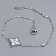 Браслет Stainless Steel з білою емаллю. Сталь. Позолота ЧВ. Камені: циркон. Довжина: 16.5-19.5 см. Ширина: 14 мм.