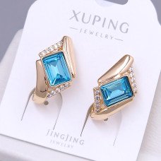 Сережки XР. Позолота 18К. Камені: Swarovski бірюзового кольору та циркон. Довжина: 20 мм. Ширина: 12 мм.