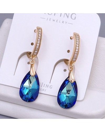 Сережки XР. Позолота 18К. Камені: Swarovski синього кольору та циркон. Довжина: 36 мм. Ширина: 9 мм