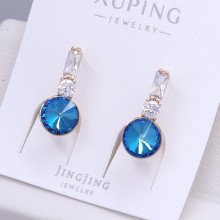 Сережки XР. Позолота 18К. Камені: Swarovski ніжно-синього кольору та циркон. Довжина: 20 мм. Ширина: 8 мм.