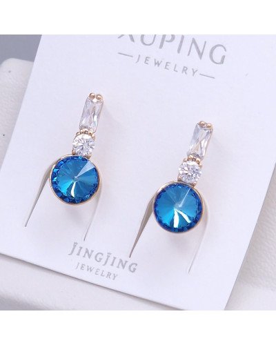 Сережки XР. Позолота 18К. Камені: Swarovski ніжно-синього кольору та циркон. Довжина: 20 мм. Ширина: 8 мм.