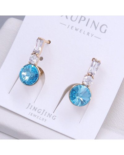 Сережки XР. Позолота 18К. Камені: Swarovski блакитного кольору та циркон. Довжина: 20 мм. Ширина: 8 мм.