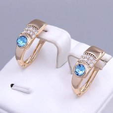 Сережки XР. Позолота 18К. Камені: Swarovski блакитного кольору та циркон. Довжина: 20 мм. Ширина: 7 мм.