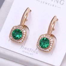 Сережки XР. Позолота 18К. Камені: Swarovski зеленого кольору та циркон. Довжина: 24 мм. Ширина: 9 мм.
