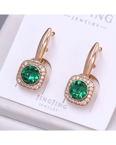 Сережки XР. Позолота 18К. Камені: Swarovski зеленого кольору та циркон. Довжина: 24 мм. Ширина: 9 мм.