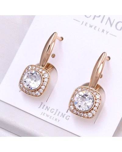 Сережки XР. Позолота 18К. Камені: Swarovski білого кольору та циркон. Довжина: 24 мм.