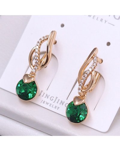 Сережки XР. Позолота 18К. Камені: Swarovski зеленого кольору та циркон. Довжина: 27 мм. Ширина: 7 мм.
