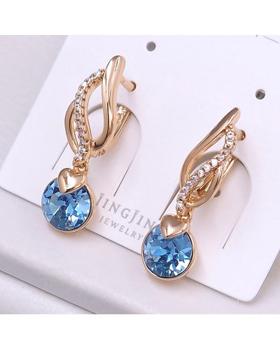Сережки XР. Позолота 18К. Камені: Swarovski бірюзового кольору та циркон. Довжина: 27 мм. Ширина: 7 мм.