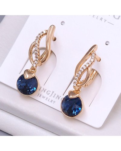 Сережки XР. Позолота 18К. Камені: Swarovski темно-синього кольору та циркон. Довжина: 27 мм. Ширина: 7 мм.
