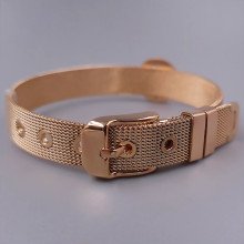 Жорсткий браслет Stainless Steel з білою емаллю. Сталь. Позолота ЧВ. Довжина: 21 см. Ширина: 15 мм.