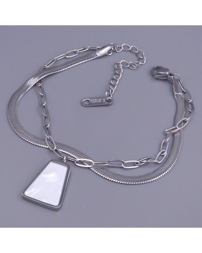 Браслет Stainless Steel з білою емаллю. Сталь. Родій. Довжина: 17-22 см. Ширина: 12 мм.