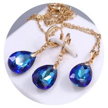 Набір ХР. Сережки та кулон на ланцюжку зі Swarovski синього кольору. Мед. золото 18К Ланцюжок: 40-45 см. Сережки: 35 мм.