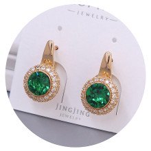 Сережки XР. Позолота 18К. Камені: Swarovski зеленого кольору та білий циркон. Довжина: 20 мм. Ширина: 12 мм.