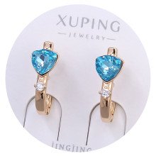 Сережки XР. Позолота 18К. Камені: Swarovski блакитного кольору та білий циркон. Довжина: 19 мм. Ширина: 7 мм.