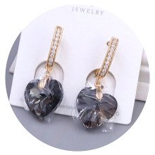 Сережки XР. Позолота 18К. Камені: Swarovski чорного кольору та білий циркон. Довжина: 34 мм. Ширина: 14 мм.