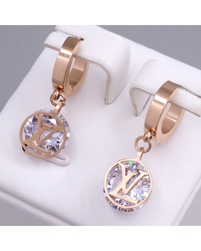 Сережки Stainless Steel. Сталь. Позолота ЧВ. Камені: білий циркон. Довжина: 26 мм. Ширина: 10 мм.