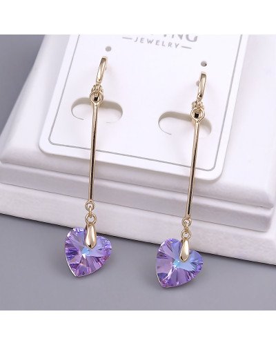 Сережки XР зі Swarovski. Мед. золото 18К. Довжина: 49 мм. Ширина: 9 мм.
