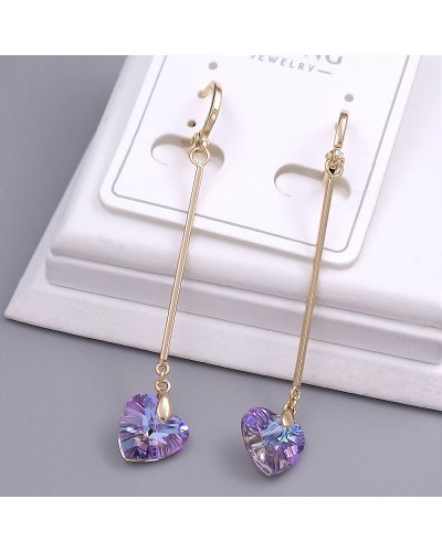 Сережки XР зі Swarovski. Мед. золото 18К. Довжина: 59 мм. Ширина: 9 мм.
