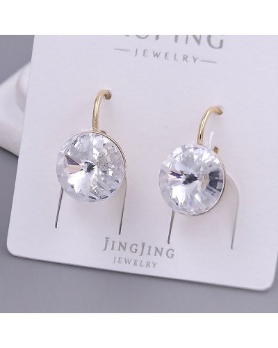 Сережки XР зі Swarovski білого кольору. Мед. золото 18К. Довжина: 18 мм. Ширина: 11 мм.