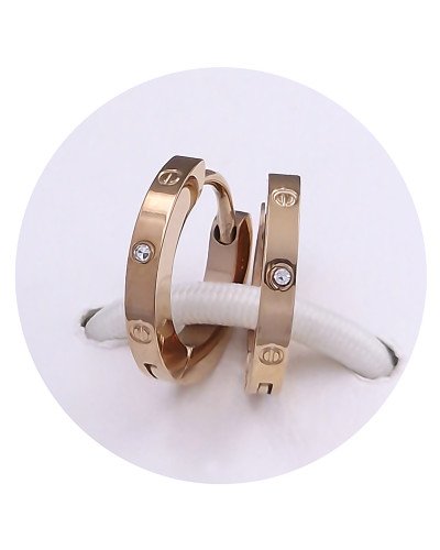 Сережки Stainless Steel. Сталь. Під золото ЧВ. Камені білого кольору. Діаметр: 13 мм. Ширина: 2 мм.